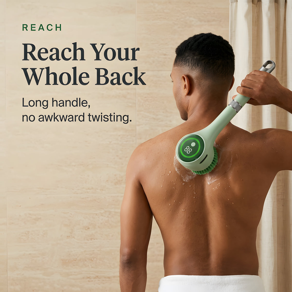 Person in a towel using the long-handle electric scrubber to wash the middle of their back without twisting