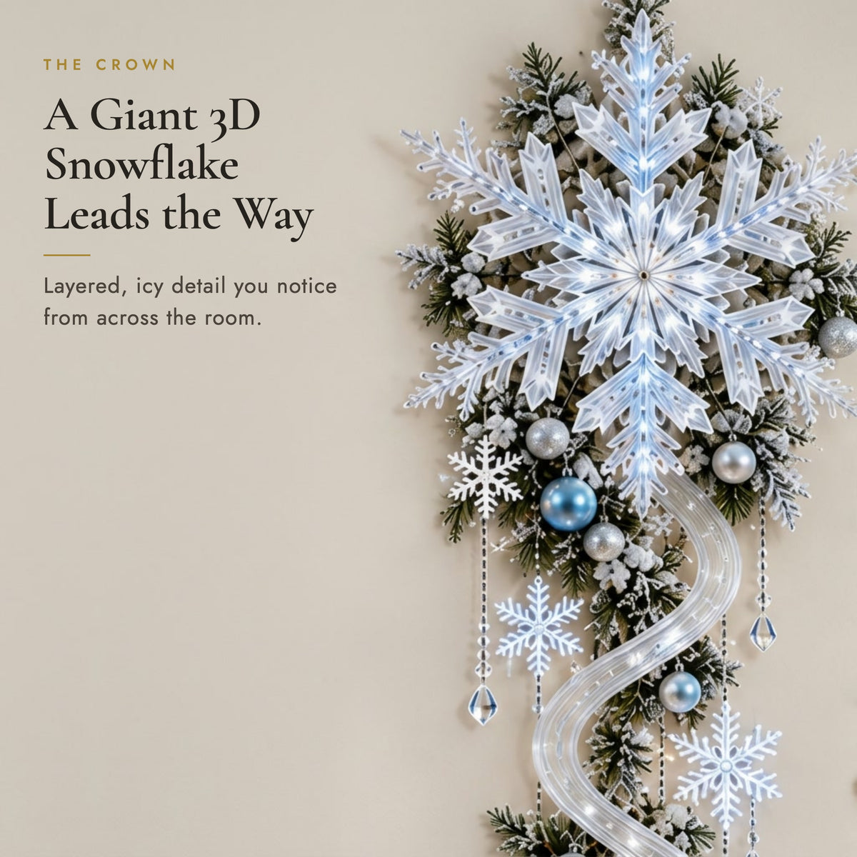 Close-up of the giant 3D frosted snowflake crown with pine sprigs and silver and ice-blue baubles
