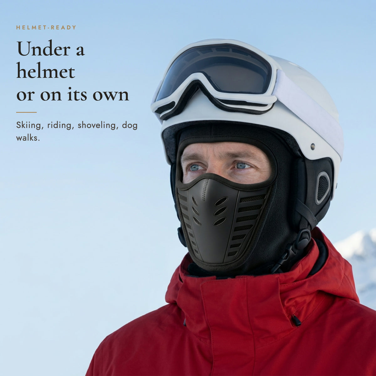 Skier wearing the vented fleece balaclava ski mask under a white ski helmet, headline Under a helmet or on its own